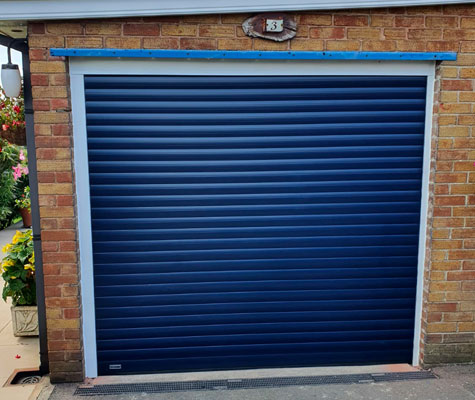 dark blue garage door new brown brick modern contemporary Harrogate
